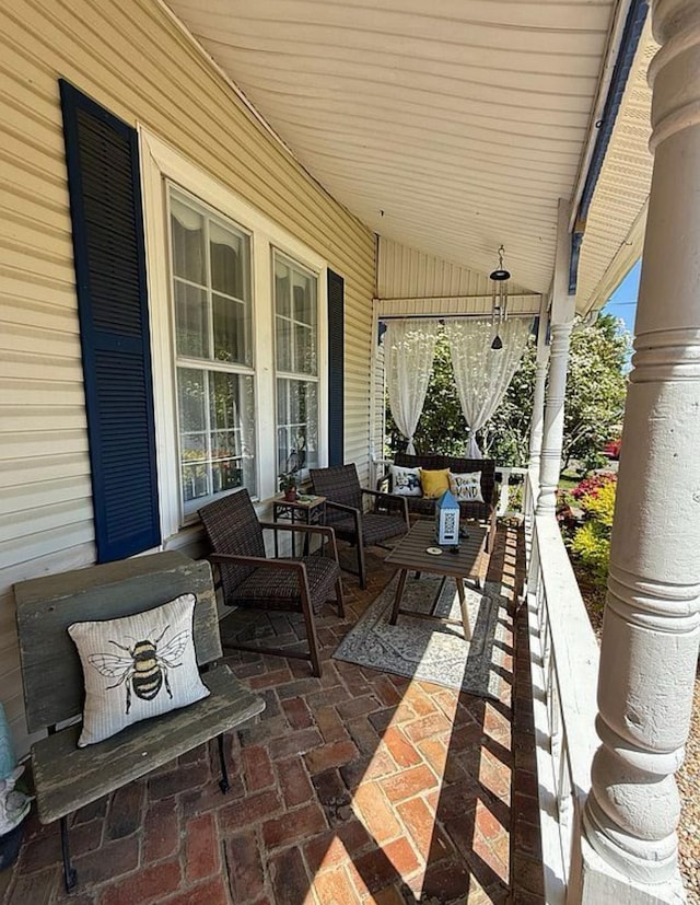  - covered porch featuring outdoor lounge area
