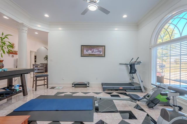 workout area featuring decorative columns, ceiling fan, and ornamental molding