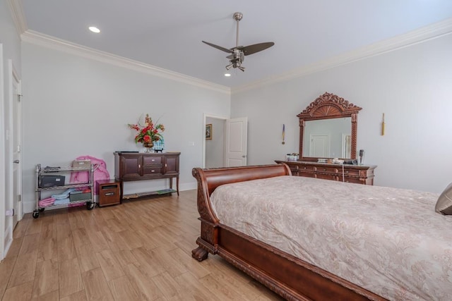 bedroom with light wood-type flooring, ceiling fan, and ornamental molding