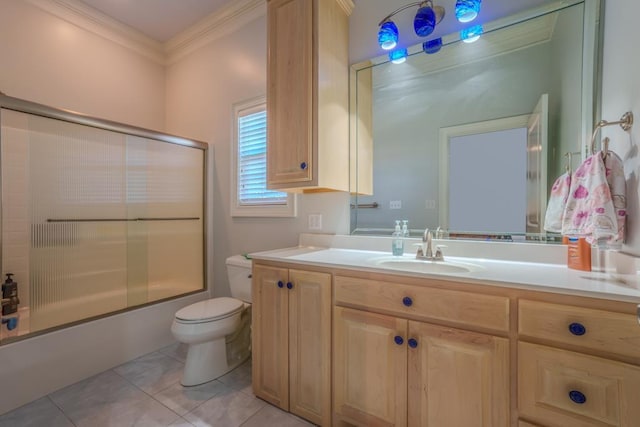 full bathroom with tile patterned floors, crown molding, toilet, shower / bath combination with glass door, and vanity