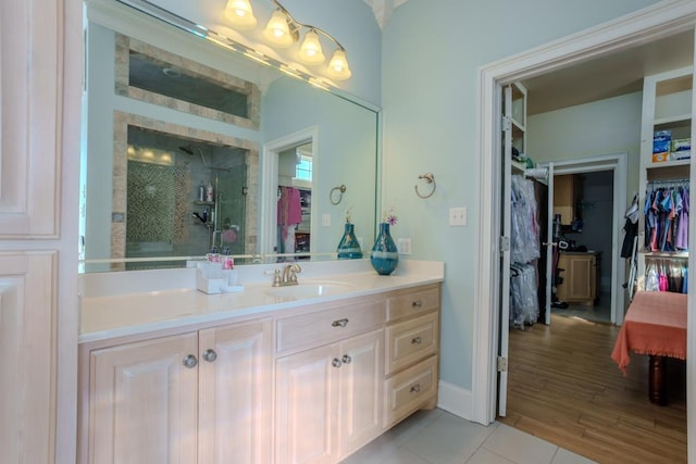 bathroom with vanity, tile patterned floors, and walk in shower