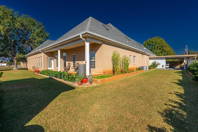 view of property exterior featuring a carport, a yard, and central AC unit