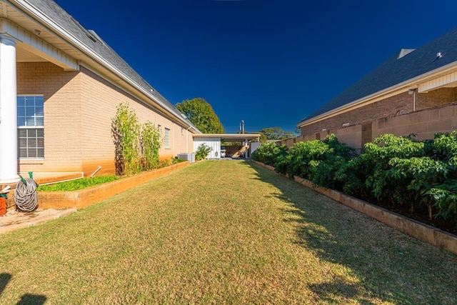 view of yard featuring central AC