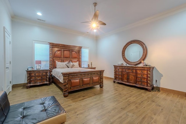 bedroom with light wood-type flooring, ceiling fan, and ornamental molding