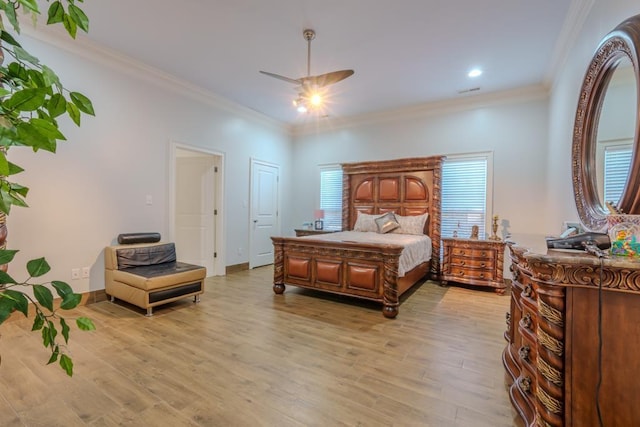 bedroom with ceiling fan, ornamental molding, and light hardwood / wood-style flooring