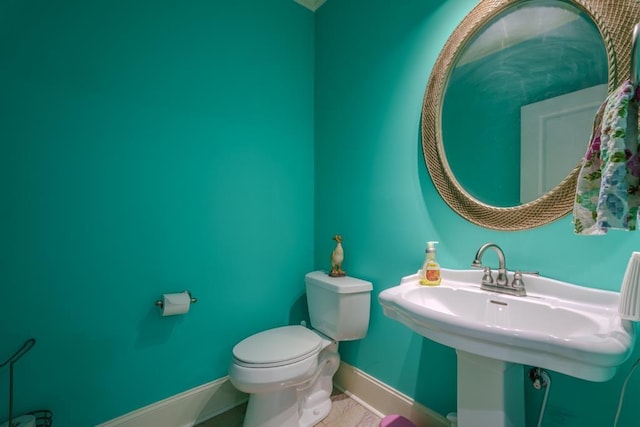 bathroom featuring sink and toilet