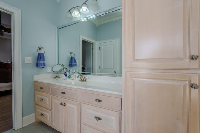 bathroom featuring tile patterned flooring and vanity