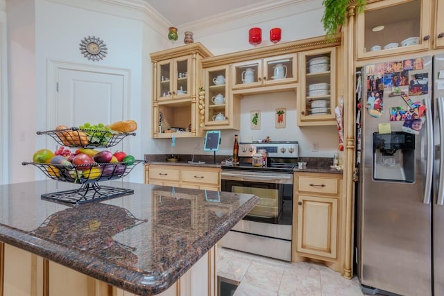 kitchen with crown molding, dark stone countertops, stainless steel appliances, and light brown cabinetry