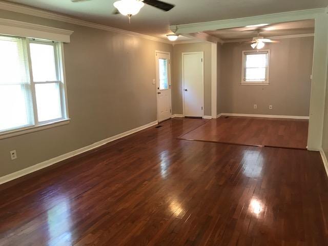 unfurnished room with dark hardwood / wood-style floors, ceiling fan, and ornamental molding