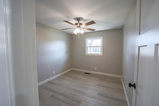 spare room with ceiling fan and light hardwood / wood-style floors