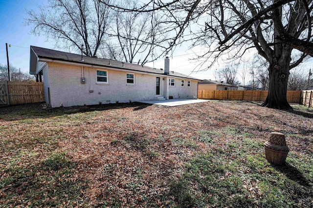 rear view of house with a patio