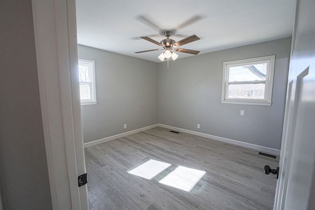 unfurnished room featuring light hardwood / wood-style flooring and ceiling fan