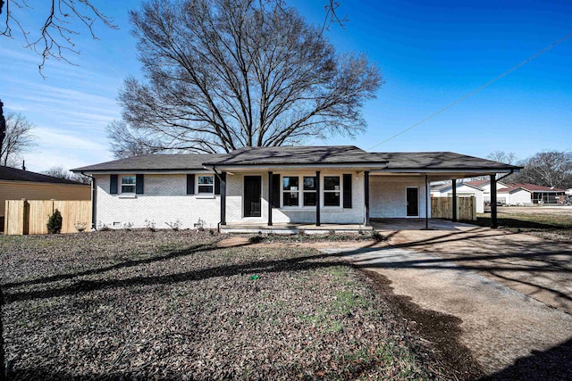 view of front facade featuring a carport and covered porch