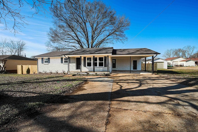 ranch-style house featuring a porch