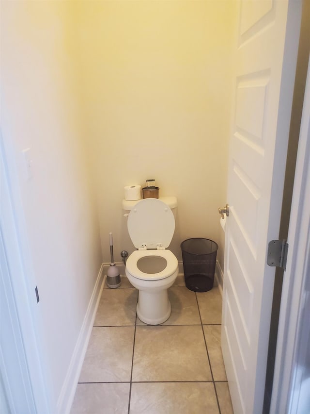 bathroom with tile patterned floors and toilet