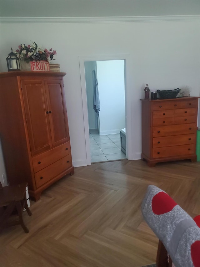 bedroom featuring crown molding and light parquet floors