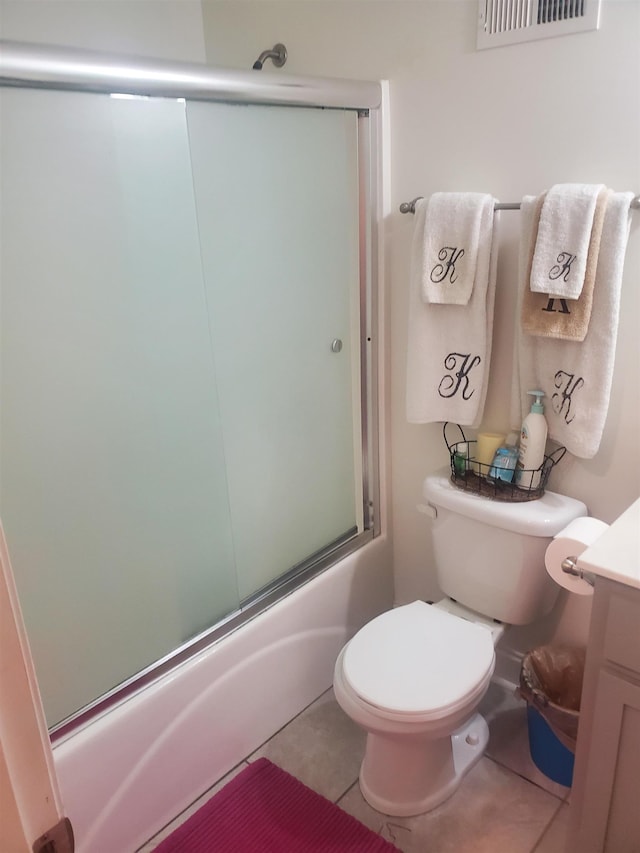 full bathroom with tile patterned flooring, vanity, toilet, and enclosed tub / shower combo