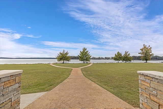  - view of home's community featuring a water view and a lawn