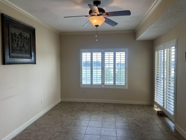  - unfurnished room featuring a textured ceiling, a ceiling fan, ornamental molding, and baseboards