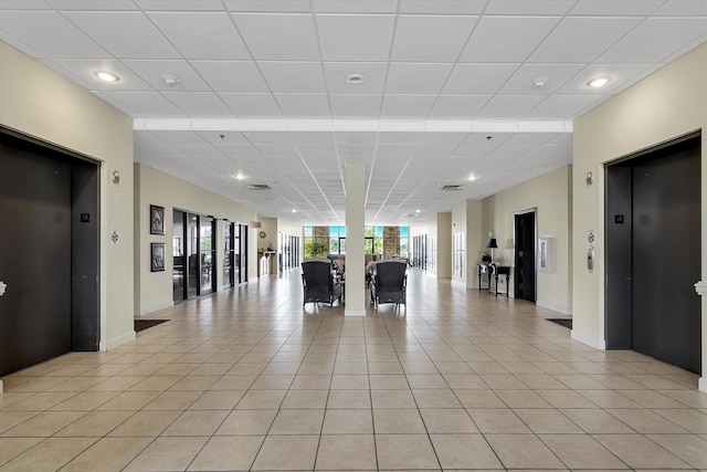  - building lobby with recessed lighting and a drop ceiling