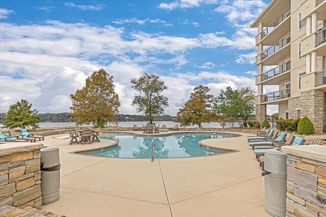  - community pool with a patio area