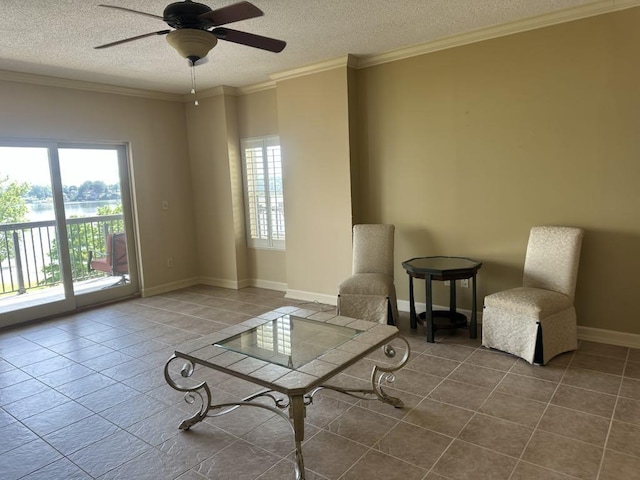  - living area with plenty of natural light, a textured ceiling, tile patterned flooring, a ceiling fan, and crown molding