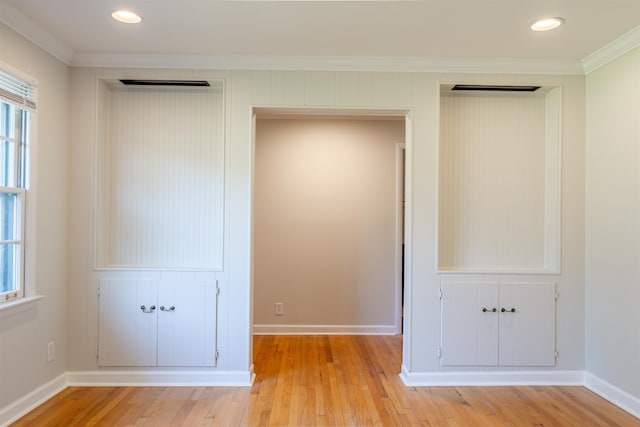 interior space with baseboards, recessed lighting, crown molding, and light wood-style flooring
