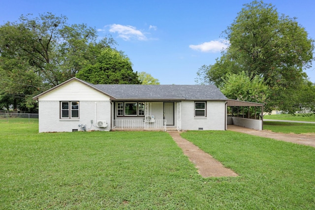 ranch-style house featuring covered porch, a carport, and a front yard