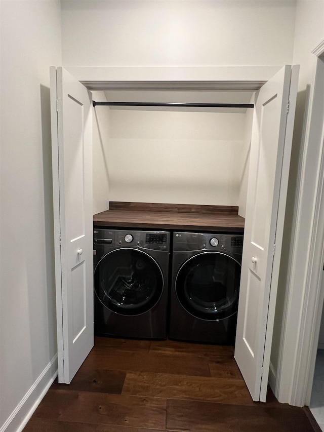  - laundry room with separate washer and dryer and dark wood-style flooring