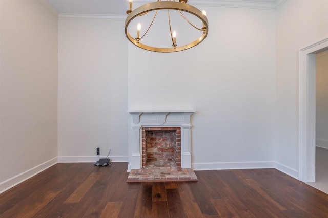  - unfurnished living room featuring a chandelier, wood finished floors, baseboards, ornamental molding, and a fireplace with raised hearth