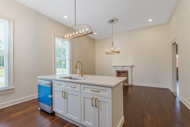  - kitchen with a sink, dishwashing machine, a chandelier, plenty of natural light, and recessed lighting