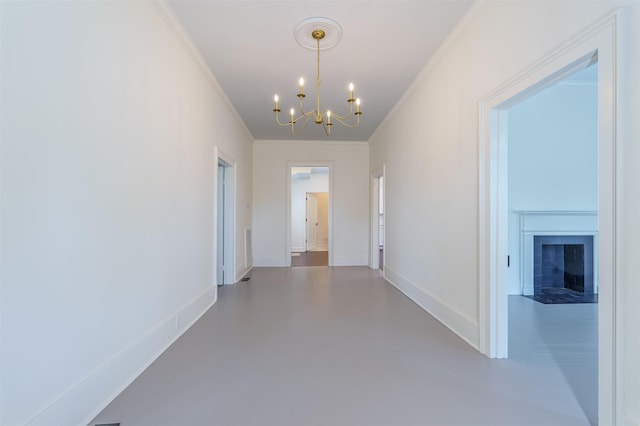  - corridor featuring ornamental molding, a chandelier, finished concrete flooring, and baseboards