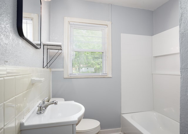 full bath featuring toilet,  shower combination, and vanity