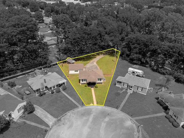 birds eye view of property with a view of trees and a residential view