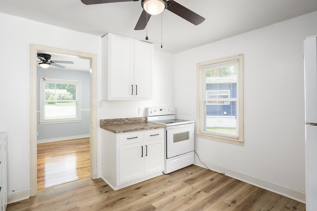 kitchen featuring white cabinetry, a ceiling fan, white electric range, baseboards, and light wood-style floors