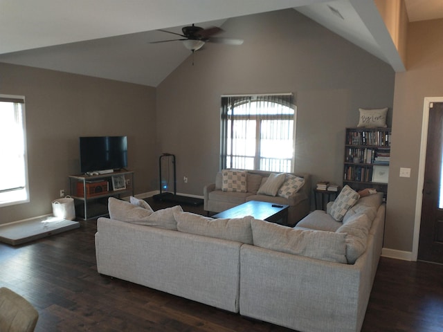 living room with ceiling fan, dark hardwood / wood-style floors, and high vaulted ceiling