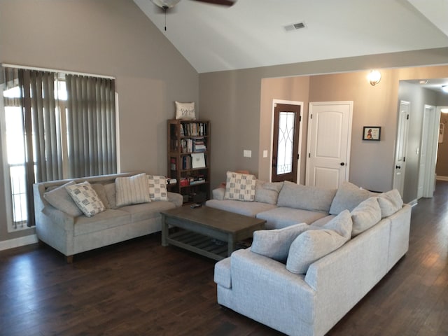 living room featuring dark wood-type flooring, ceiling fan, and high vaulted ceiling