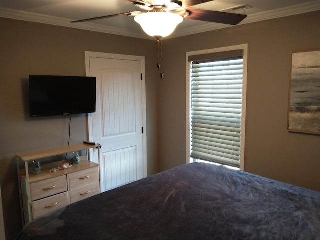 bedroom featuring crown molding and ceiling fan