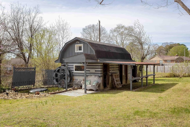 - view of barn with fence and a yard