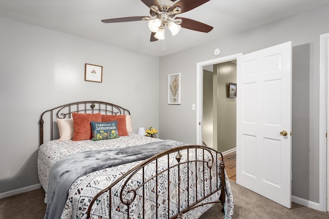  - bedroom featuring baseboards, ceiling fan, and light carpet