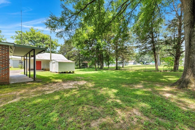 - view of yard with a storage shed