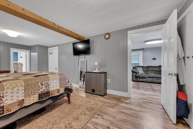  - bedroom with wood finished floors and a wood ceiling with exposed beams