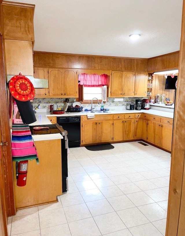 kitchen with light tile patterned floors, black dishwasher, and sink