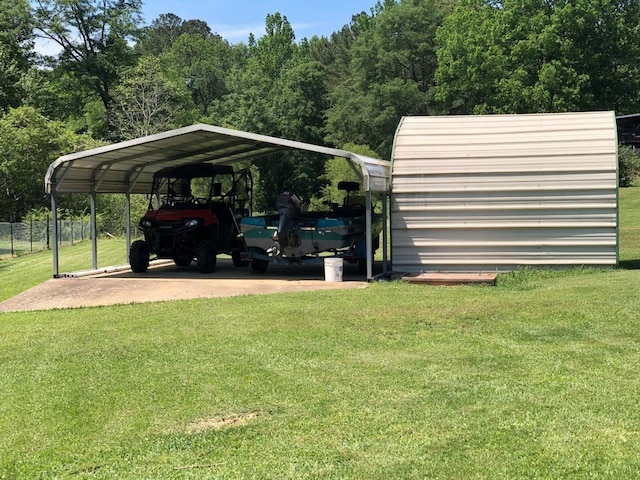 view of parking featuring a yard and a carport