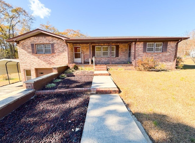 view of front of property featuring a front yard, a porch, a garage, and a carport