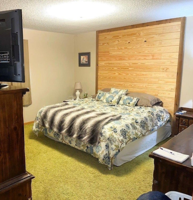 bedroom with carpet flooring and a textured ceiling