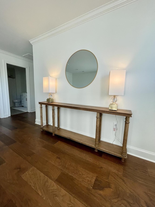 details with hardwood / wood-style flooring and ornamental molding