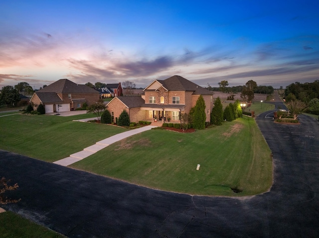 traditional-style home featuring a front yard
