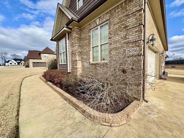 view of side of home featuring a garage