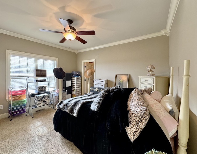 bedroom featuring ceiling fan, crown molding, and carpet floors